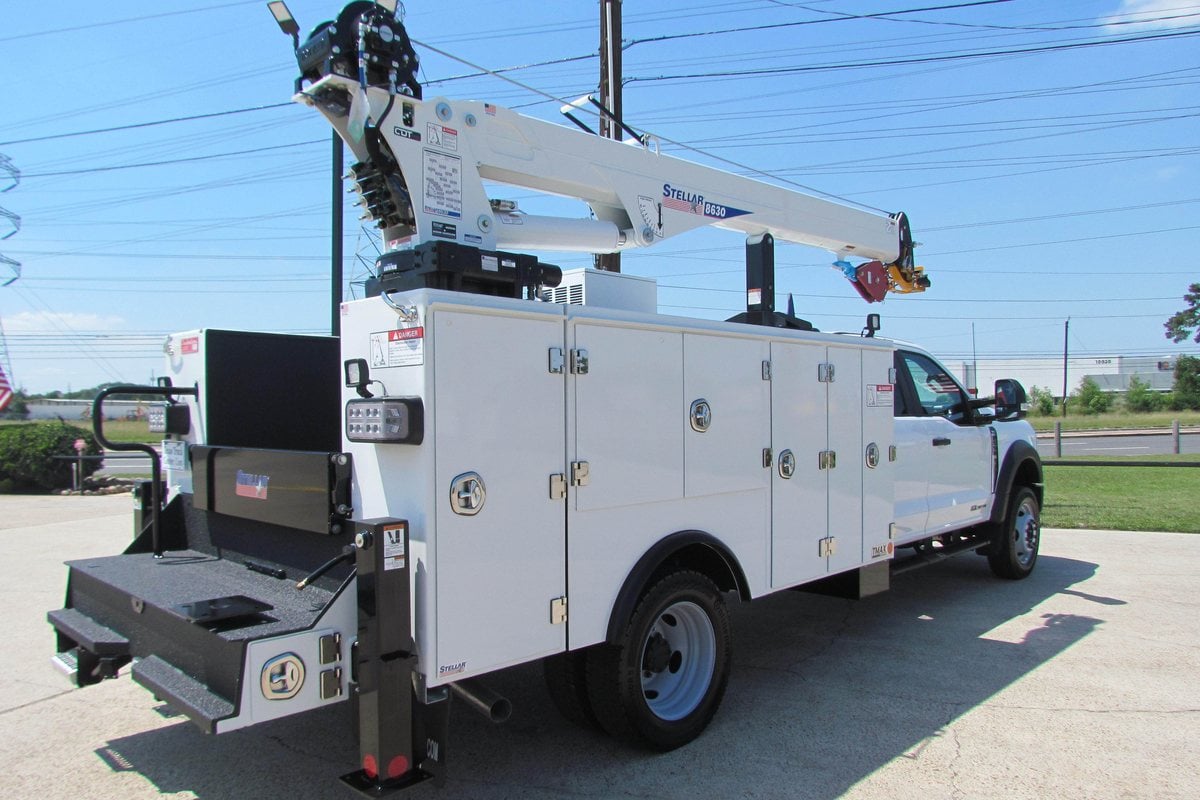 Rear three-quarter view of a Stellar TMAX 1 mechanic truck with service crane
