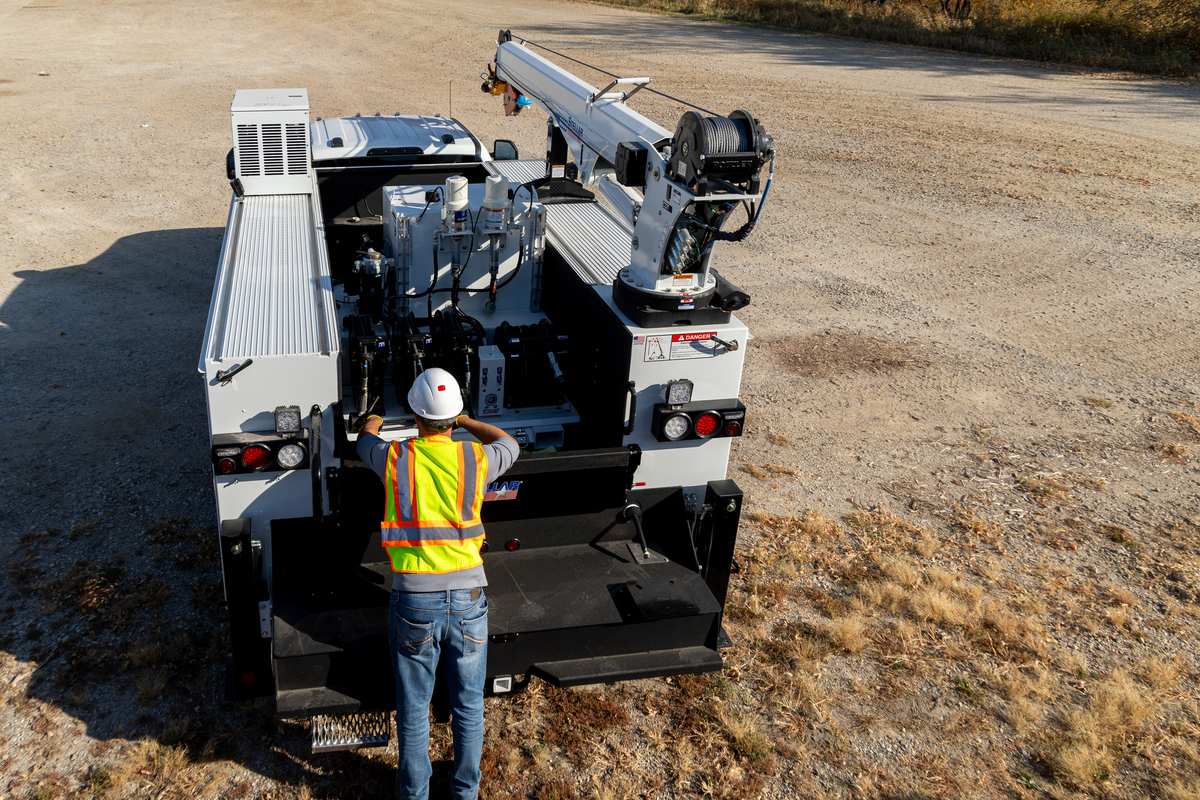 Aerial view of a technician working at the rear of a Stellar TMAX 1