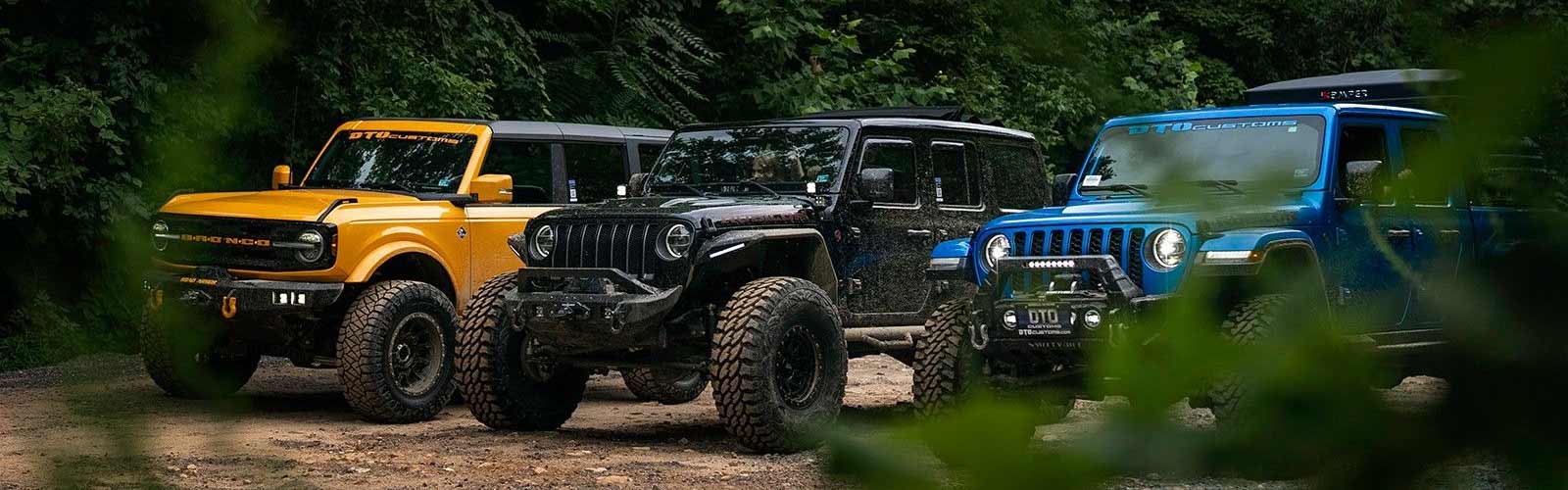Three Jeeps In Woods